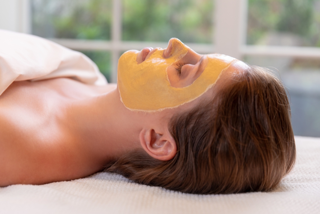 Guest with a facial mask treatment at Spa33