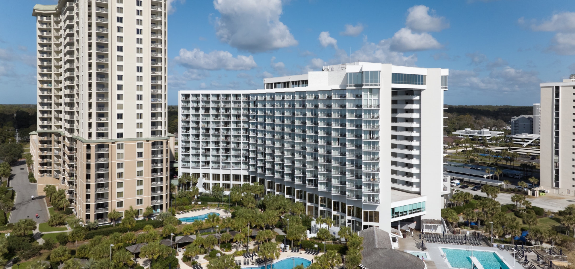 Drone view of Royale Palms and Hilton poolside exteriors