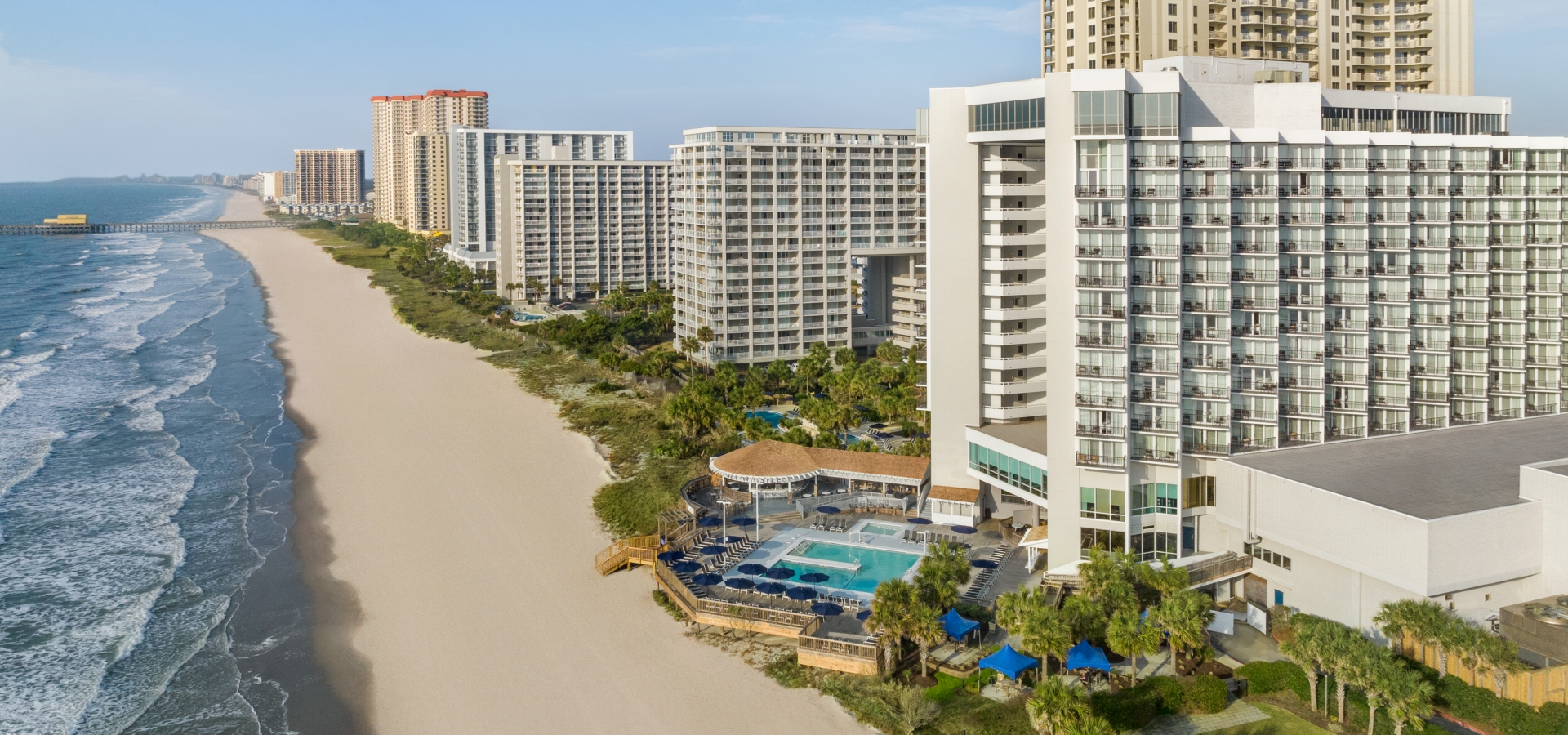 An aerial shot of Myrtle Beach with hotels and condos in the coast.